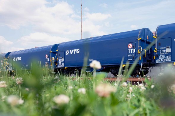 Three blue VTG standard freight wagons.